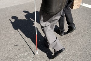 Paul Dana and Jim Blacksten carry back goods bought from Walgreens. Jim suffers from cataracts in his eyes, which made him legally blind. He says after surgery to his left eye he can now see shapes and colors, especially during the daytime. (San Francisco, Calif. March 28, 2009)